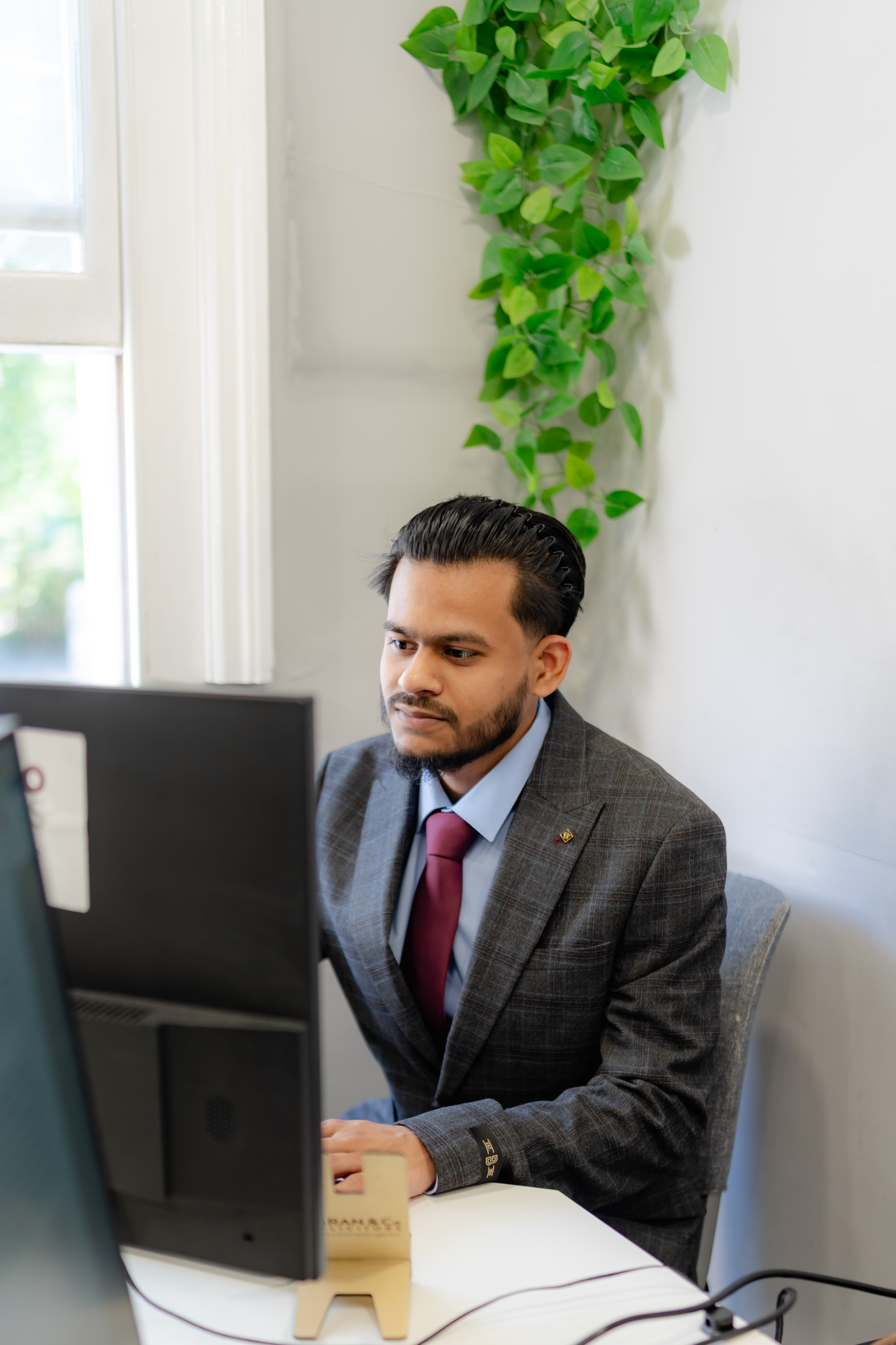 Shahriar Ahmed Shakir working at a desk
